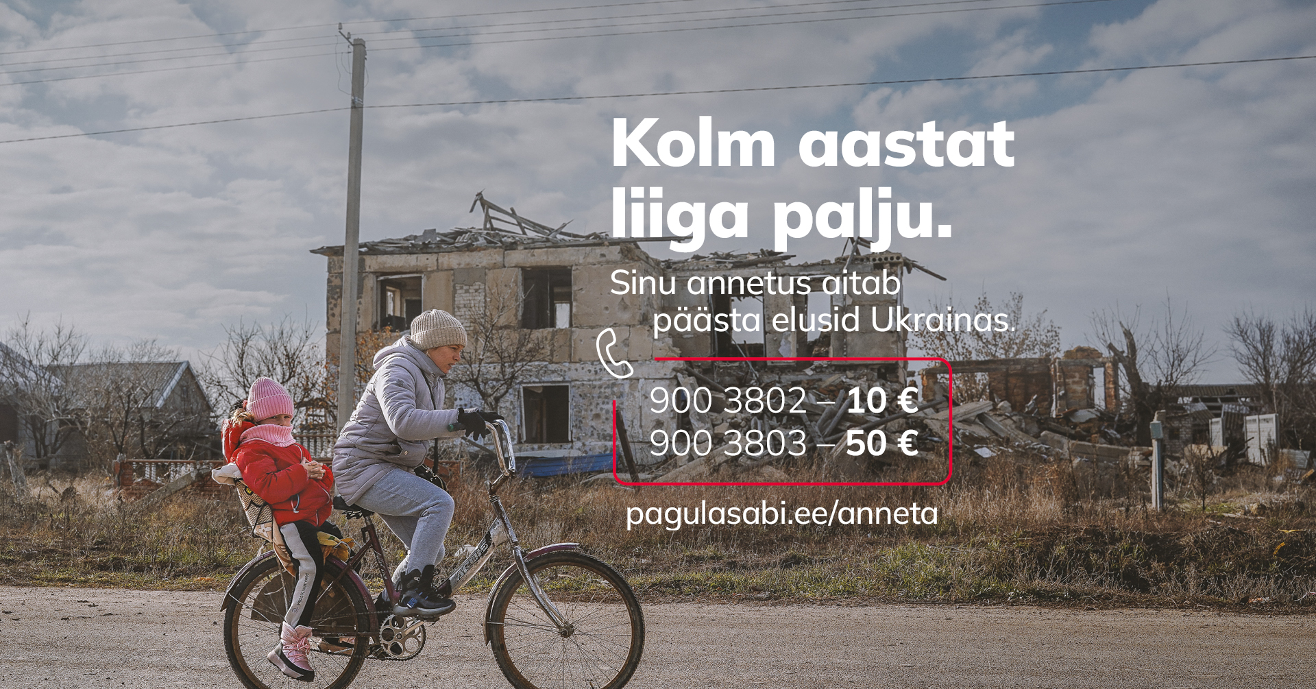 Woman on a bicycle with a child in war torn Ukraine