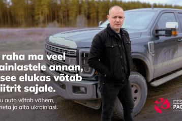 Man standing in front of a massive truck 