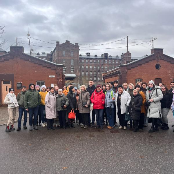 People standing infront of a building 